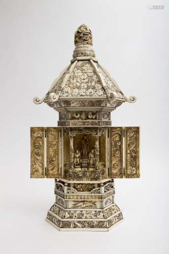 Large, temple-shaped zushi Ivory, with a hexagonal base and a pattern of dragons, lotus leaves and