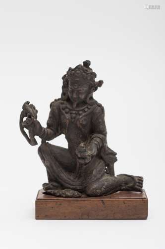 Tibetan Bodhisattva Bronze, in the seated royal prince asana. On a wooden stand. - H: 12 cm (with