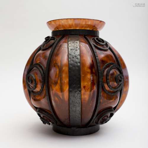 Art deco-style round vase Orange blown glass in a cast iron setting. Minor chips in the rim of the