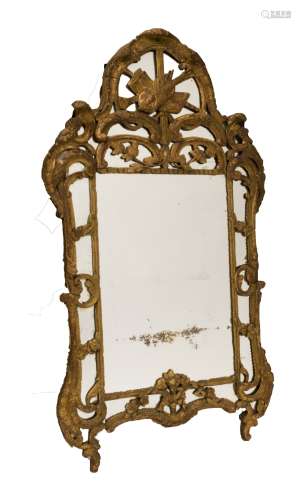 Louis XV mirror with inserts, ca 1730-1750 Carved gilded wood, decorated with musical instruments