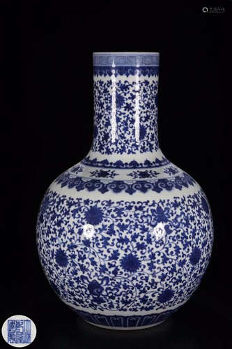 A WHITE AND BLUE WRAPPED FLORAL PATTERN VASE