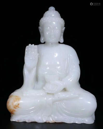 A HETIAN WHITE JADE CARVED RULAI BUDDHA