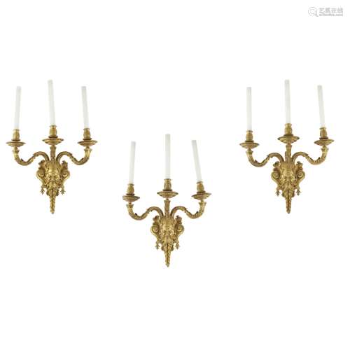 SET OF THREE GILT BRONZE WALL LIGHTSLATE 19TH CENTURY with three outscrolling arms above a large