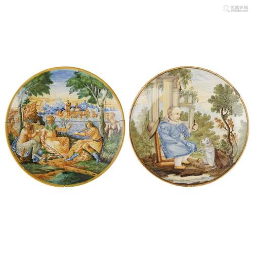 TWO ITALIAN POLYCHROME MAIOLICA PLATESLATE 19TH/ EARLY 20TH CENTURY comprising a larger example