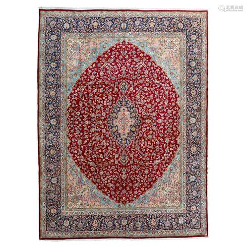 KIRMAN CARPETCENTRAL PERSIA, MID 20TH CENTURY the raspberry field with indigo and pink medallion,