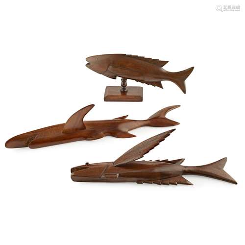 THREE PITCAIRN ISLAND CARVED TREEN FISH20TH CENTURY comprising an example with a glass eye,