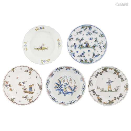 FIVE POLYCHROME FRENCH FAIENCE PLATES18TH CENTURY comprising a waved plate with a central