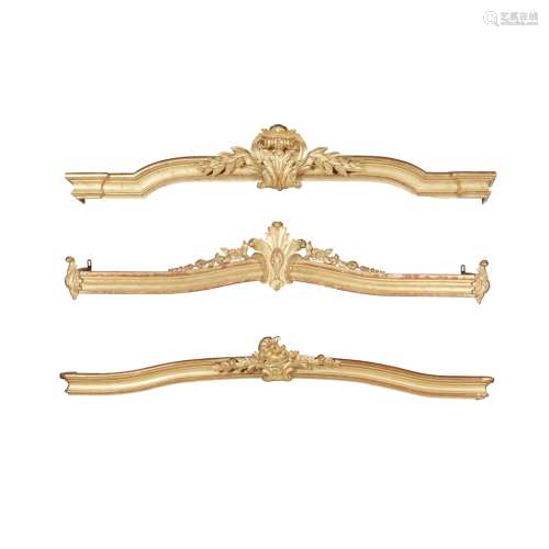THREE CARVED AND MOULDED GILTWOOD PELMETS19TH CENTURY the largest with a central fleur de lis and