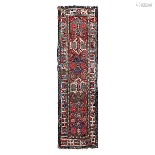 KAZAK RUNNERSOUTH CAUCASUS, LATE 19TH/EARLY 20TH CENTURY the rust brown field with six green,