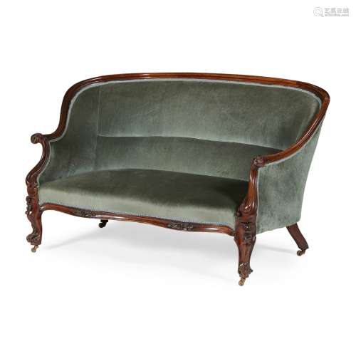 VICTORIAN WALNUT FRAMED SOFA19TH CENTURY the curved back and scrolled arms upholstered in green