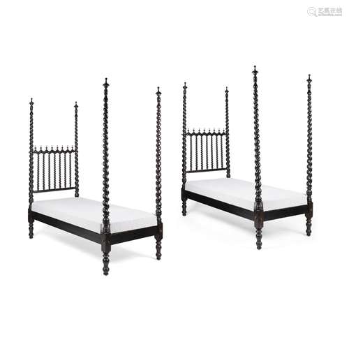 PAIR OF ANGLO-INDIAN EBONY FOUR-POST SINGLE BEDS19TH CENTURY with spiral carved spindle headboards