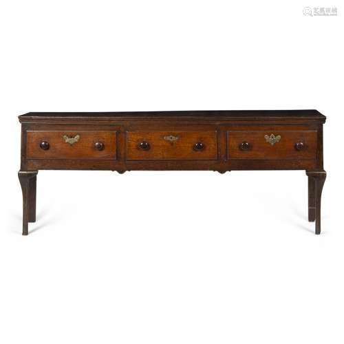 GEORGIAN OAK DRESSER BASE18TH CENTURY the top with a moulded edge over three short drawers, raised