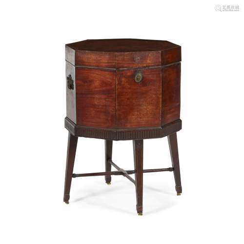 GEORGE III MAHOGANY OCTAGONAL CELLARETTE ON STAND18TH CENTURY the octagonal top opening to a lead-