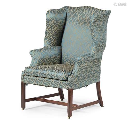 GEORGE III STYLE MAHOGANY WINGBACK ARMCHAIR19TH CENTURY the shaped toprail and deep wings over