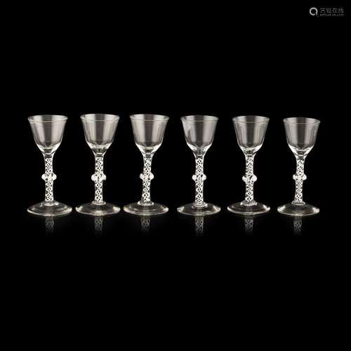 SET OF SIX OPAQUE TWIST WINE GLASSESCIRCA 1760 with ogee pointed bowls, raised on double series