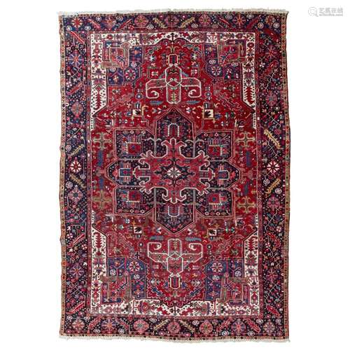 HERIZ CARPETNORTHWEST PERSIA, EARLY/MID 20TH CENTURY the dark red field with indigo and red