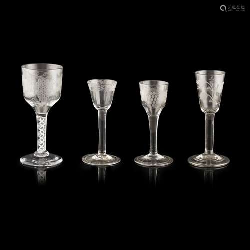 FOUR GEORGIAN ENGRAVED WINE GLASSESMID-18TH CENTURY comprising a wine goblet with an ogee bowl