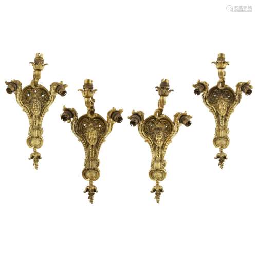 SET OF FOUR FRENCH GILT BRONZE WALL LIGHTSLATE 19TH CENTURY each with one upscrolling and two