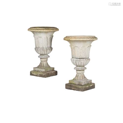 PAIR OF SCOTTISH FIRECLAY GARDEN URNS19TH CENTURY of campana form with leaf moulded sides and