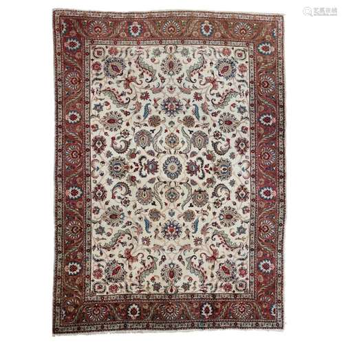 TABRIZ CARPETNORTHWEST PERSIA, MID 20TH CENTURY the cream field with allover palmette and foliate