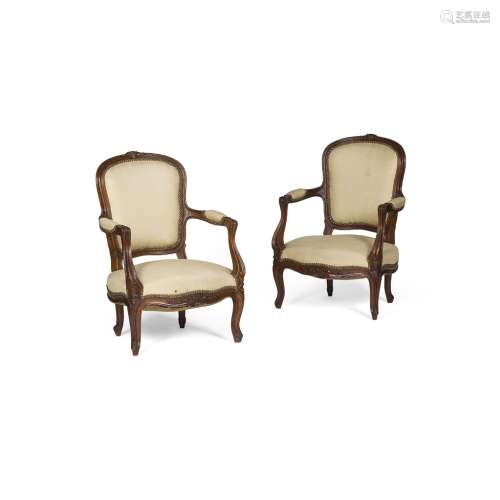 PAIR OF FRENCH WALNUT ARMCHAIRS19TH CENTURY the cartouche shaped backs and part padded arms above