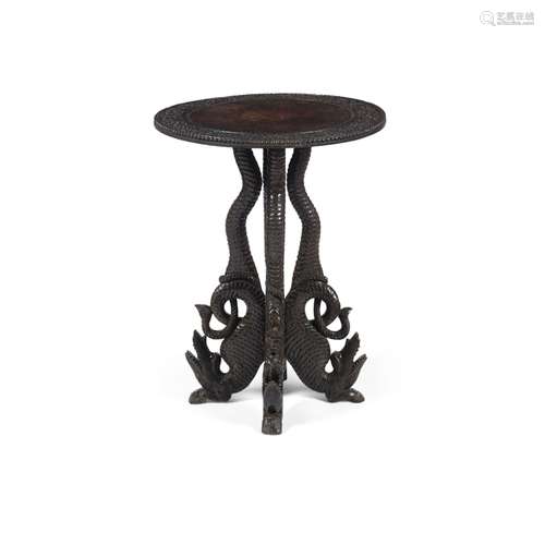 INDIAN CARVED HARDWOOD TABLELATE 19TH CENTURY the revolving circular top carved with scrolling