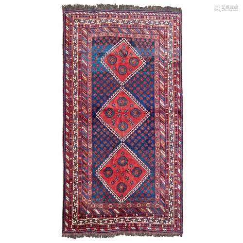 AFSHAR CARPETSOUTH PERSIA, MID 20TH CENTURY the indigo field with three red lozenge medallions,