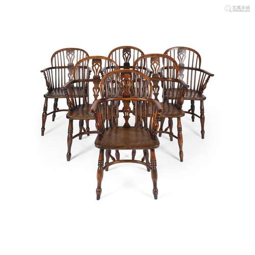 SET OF SIX YEW AND ELM WINDSOR ARMCHAIRS19TH CENTURY the low backs with pierced splats and U-