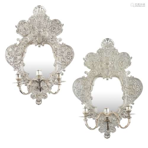 PAIR OF BAROQUE STYLE SILVERED BRASS MIRRORED WALL SCONCESLATE 19TH CENTURY of cartouche outline,