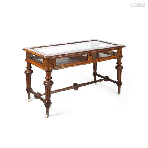 VICTORIAN OAK BIJOUTERIE TABLE19TH CENTURY the glazed rectangular top with a moulded edge and outset