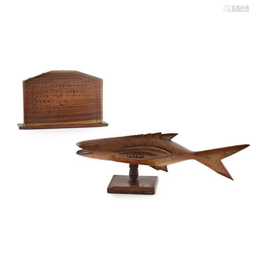 TWO PITCAIRN ISLAND TREEN CARVINGS20TH CENTURY comprising a small fish raised on a stand and