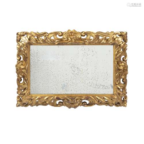 FLORENTINE GILTWOOD MIRROR19TH CENTURY the rectangular mirror plate in a frame pierced and carved