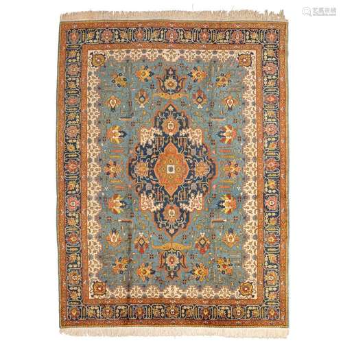 TABRIZ CARPETNORTHWEST PERSIA, MID 20TH CENTURY the blue field with indigo and red medallion, within