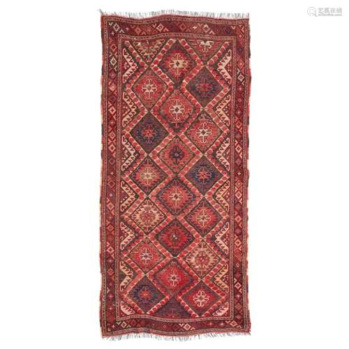 KYRGYZ RUNNERKYRGYZSTAN, LATE 19TH/EARLY 20TH CENTURY the brown field with allover red and indigo