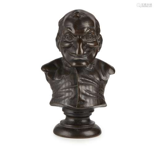 FRENCH BRONZE BUST OF MR. PUNCH19TH CENTURY with dark brown patina, raised on a circular socle