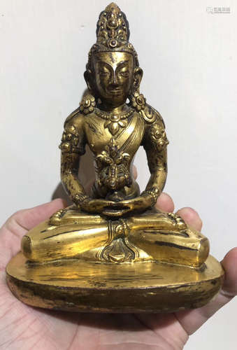 A GILT BRONZE LIFELESS BUDDHA