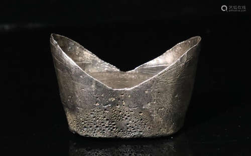 A QING DYNASTY SILVER CASTED INGOT