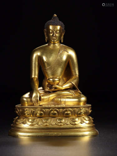 A GILT BRONZE CASTED SAKYAMUNI BUDDHA WITH BASE