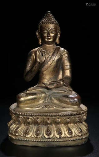 A GILT BRONZE SAKYAMUNI BUDDHA