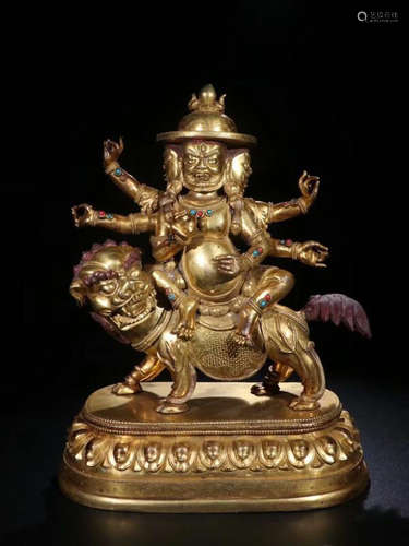 A GILT BRONZE MULTI-ARM BUDDHA