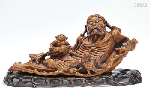 A Chinese Huangyang Wood Carving With Stand