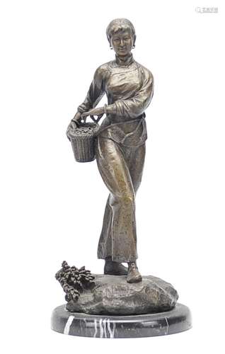 A Chinese Bronze Tea Plucking Lady Sculpture