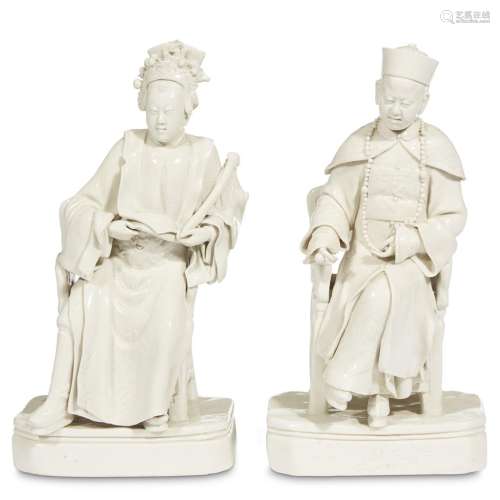 A pair of blanc de Chine figures of a mandarin and lady