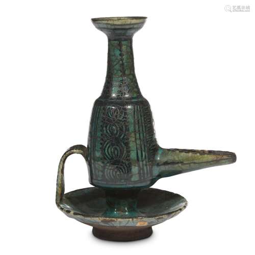 A Persian turquoise-glazed pottery lamp
