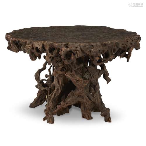 A Chinese circular rootwood table and four stools