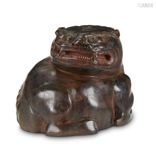 A Chinese carved hardwood lion-form cup