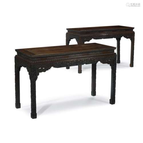 *A fine and rare pair of Chinese carved hardwood, possibly 