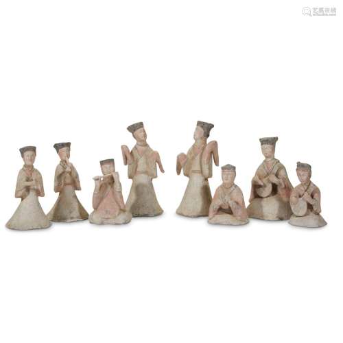 A group of eight painted pottery musicians and dancers