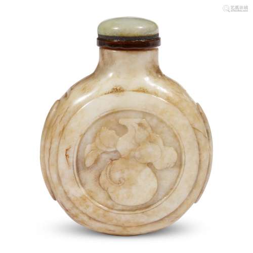 A Chinese carved beige jade 