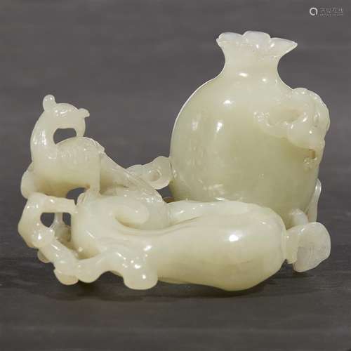 A Chinese carved pale celadon jade 